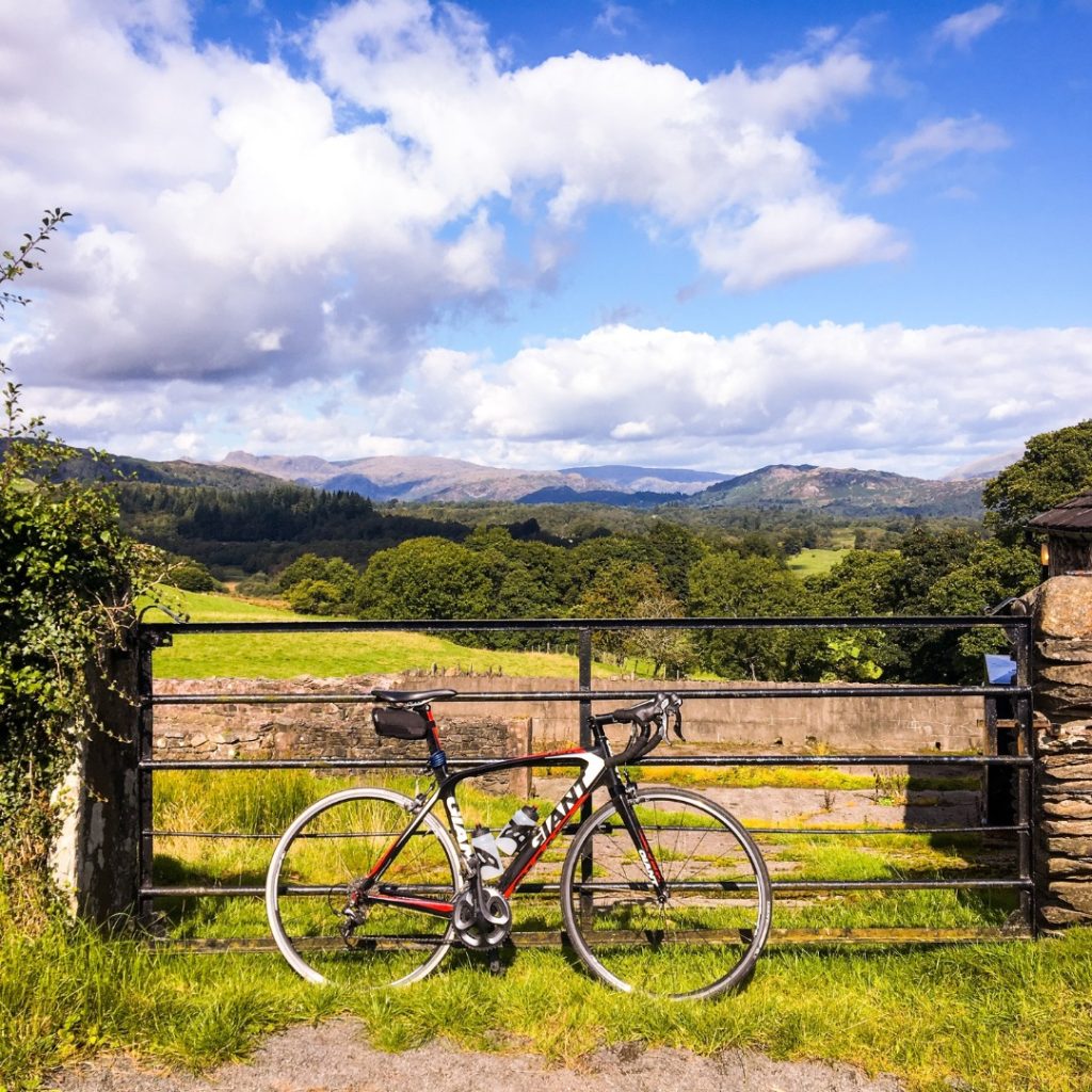 A bike resting by a gate in the Lake District